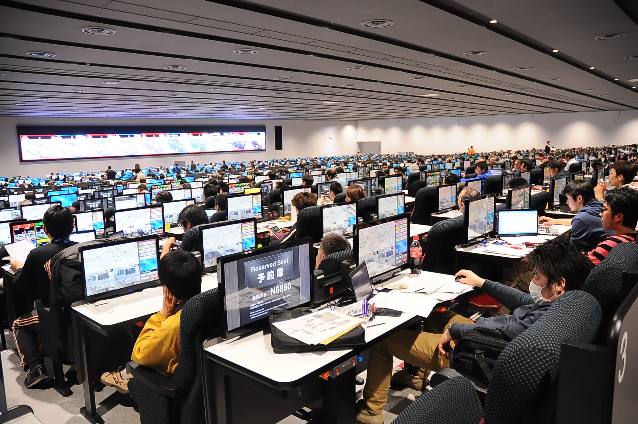 Rows of cars at a Japanese auto auction house