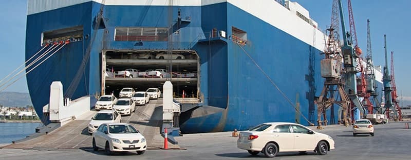 Car being loaded into a shipping container